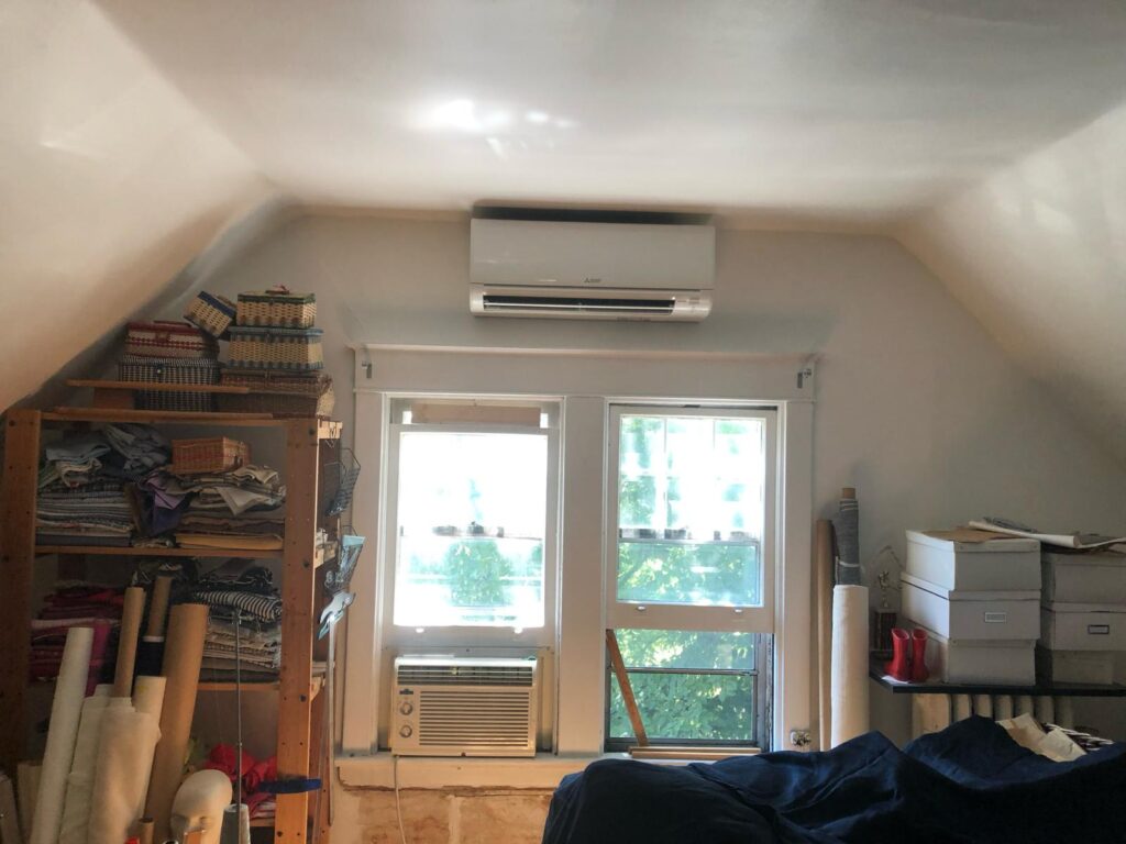 Ductless Solutions HVAC technician installing a Mitsubishi heat pump in Toronto